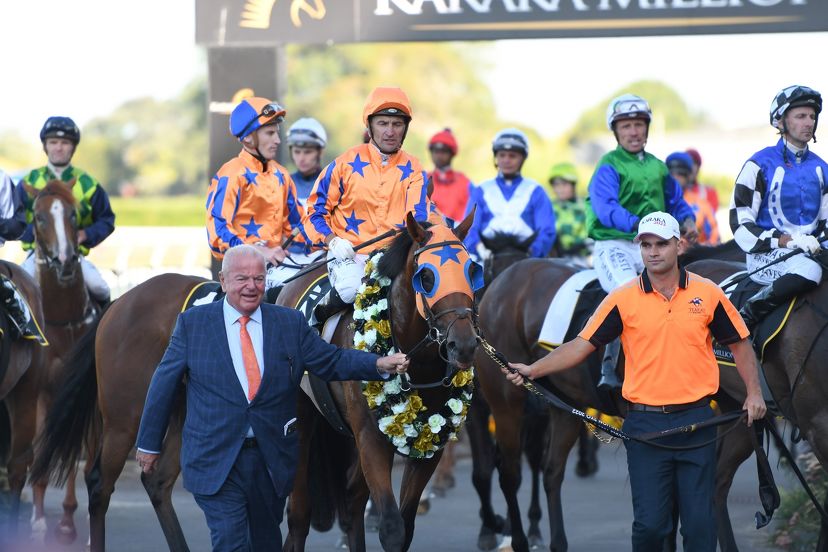 Te Akau supremo David Ellis and strapper Liam Cunningham escort Karaka Million 2YO winner Dynastic a